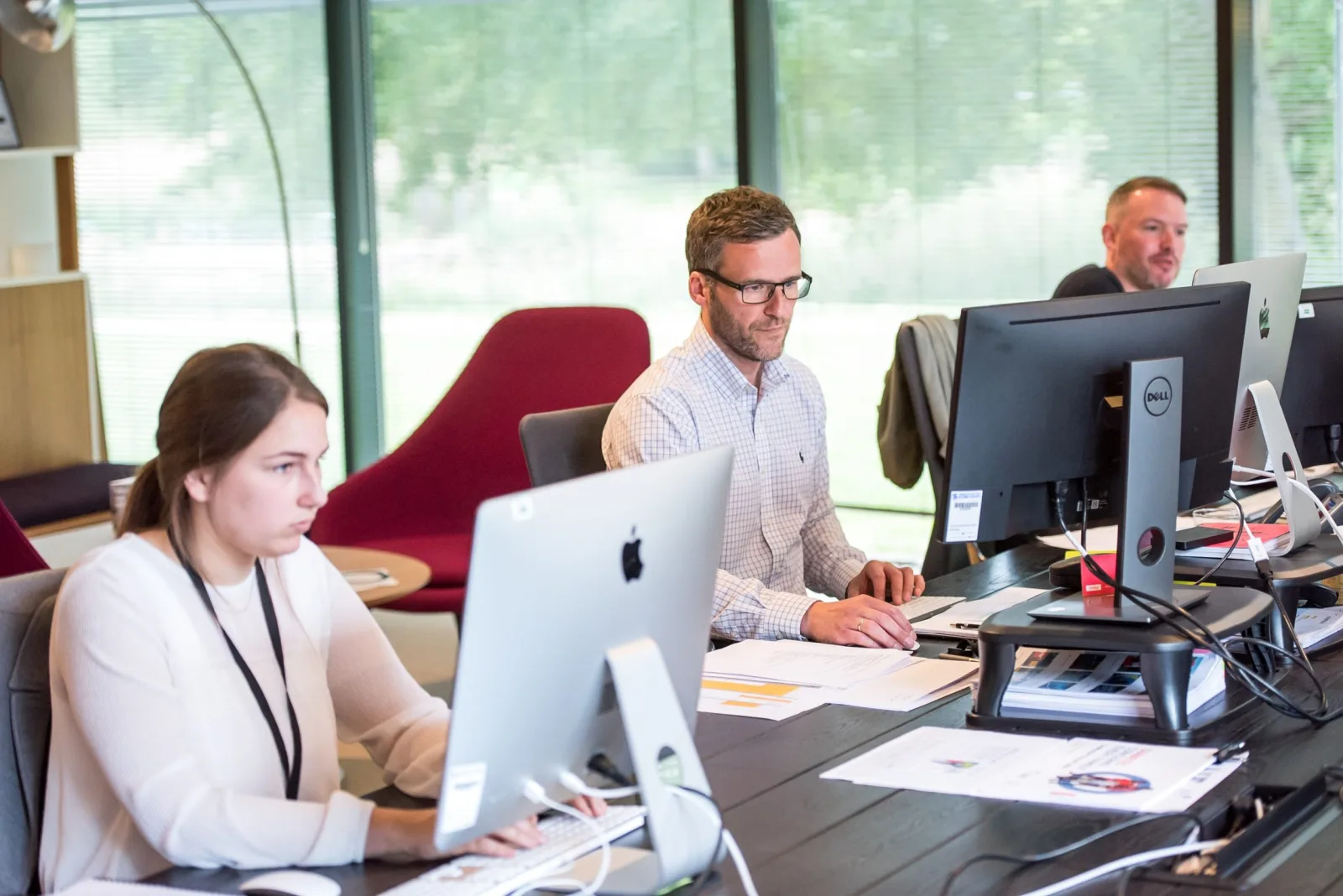 People working at desks in an open-plan Sheffield office